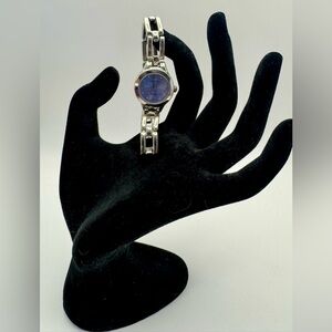 Silver Tone Watch With a Chain Link Band